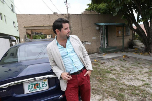 Local realtor and house flipper Jorge Artiles stands outside a property he and business partners recently purchased in Allapattah. CHARLES TRAINOR JR MIAMI HERALD STAFF